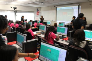 The girls working in a computer lab - Tech Sassy